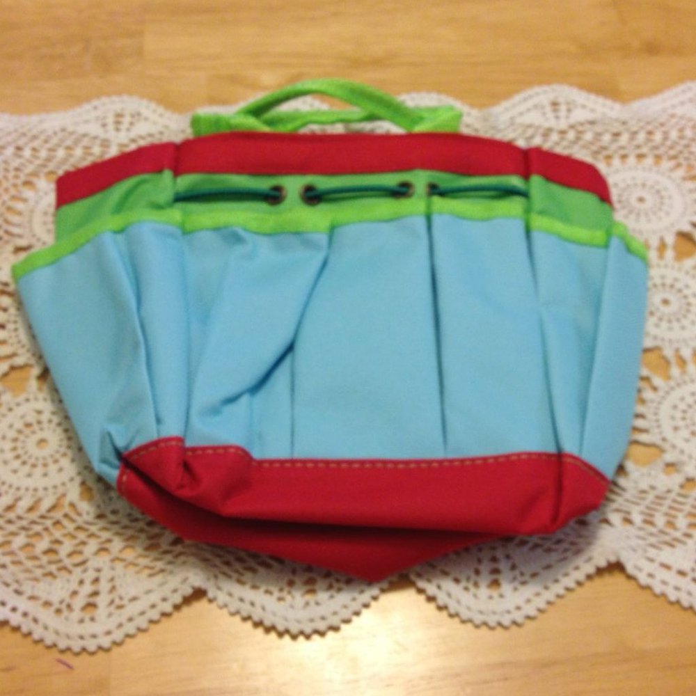 Cute, small bag for makeup, art supplies, small gardening tools, etc.